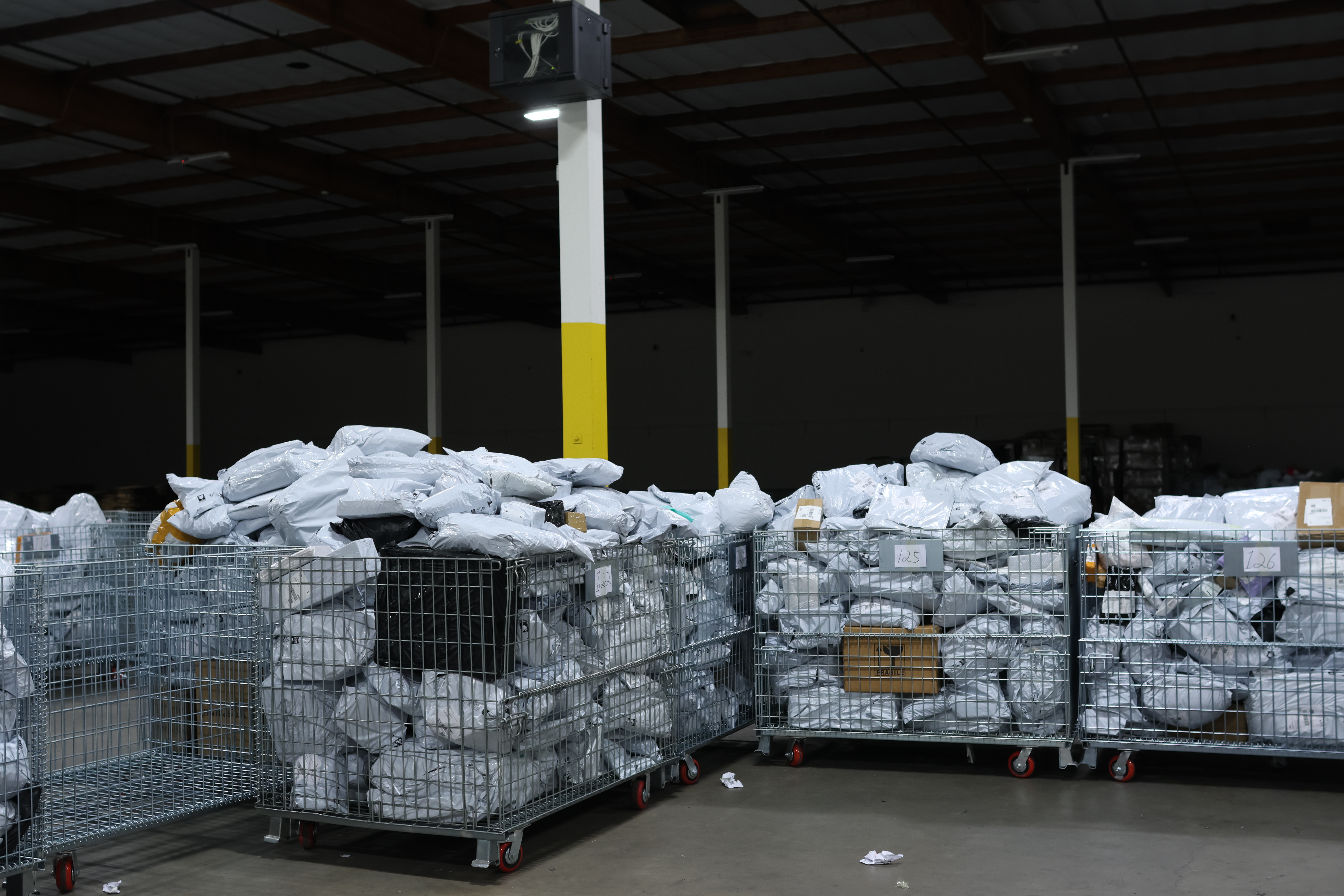 Packages await sorting and delivery inside a warehouse in Los Angeles