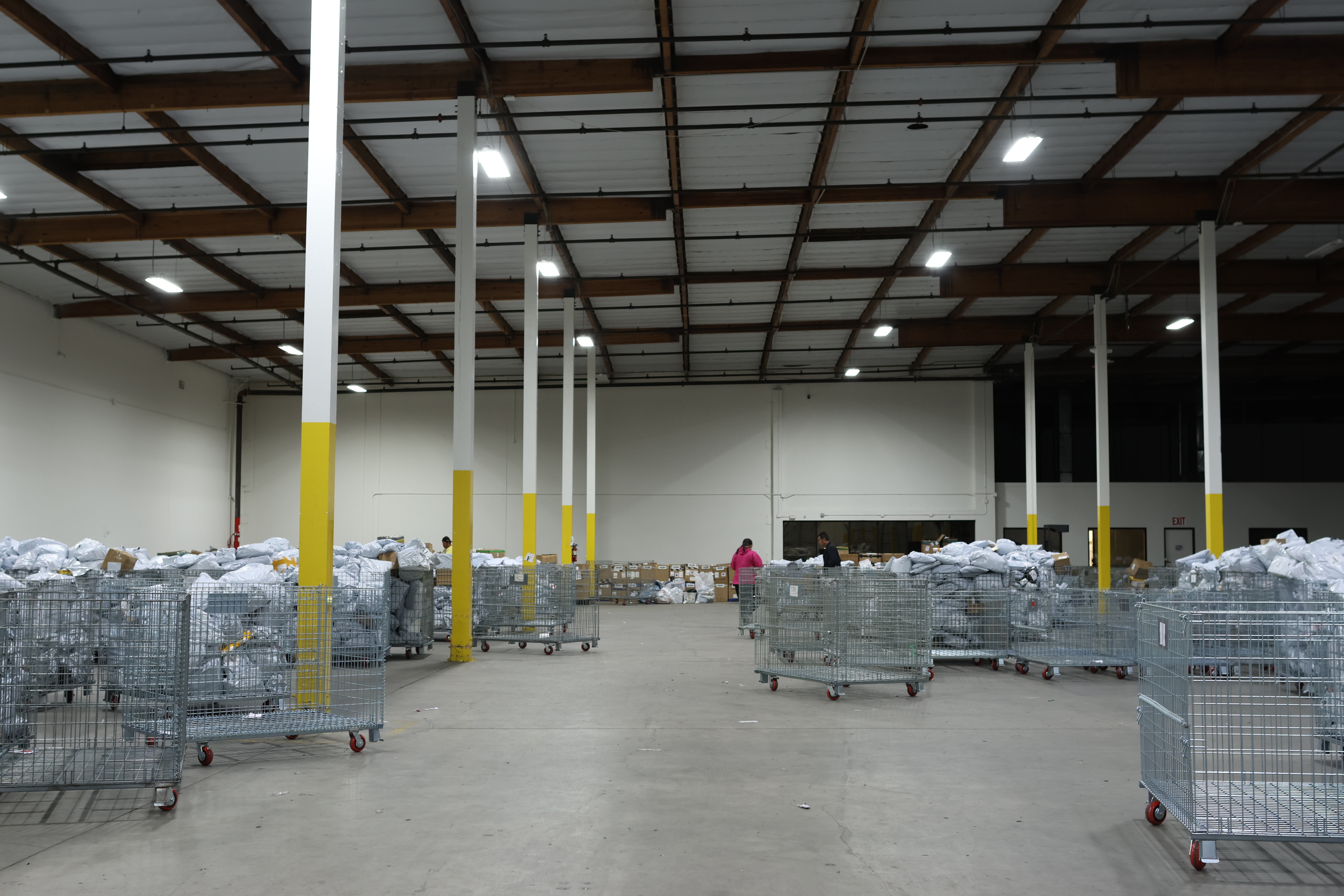 Packages await sorting and delivery inside a warehouse in Los Angeles